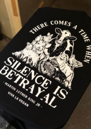 Detailed display of vegan Tshirt graphics. Silence equals violence print detail
