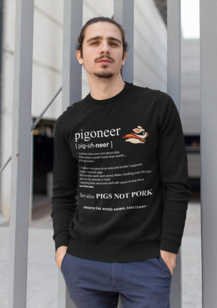 young man wearing a black pigoneer sweatshirt by Viva la vegan